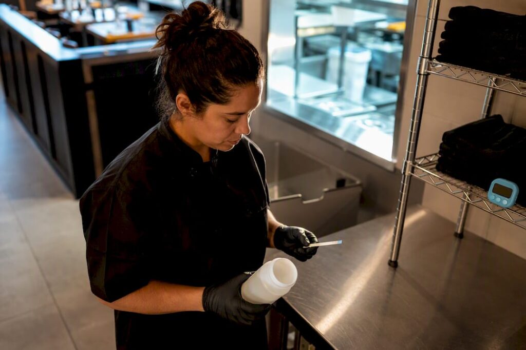 Supervisor testing restaurant sanitizer solution